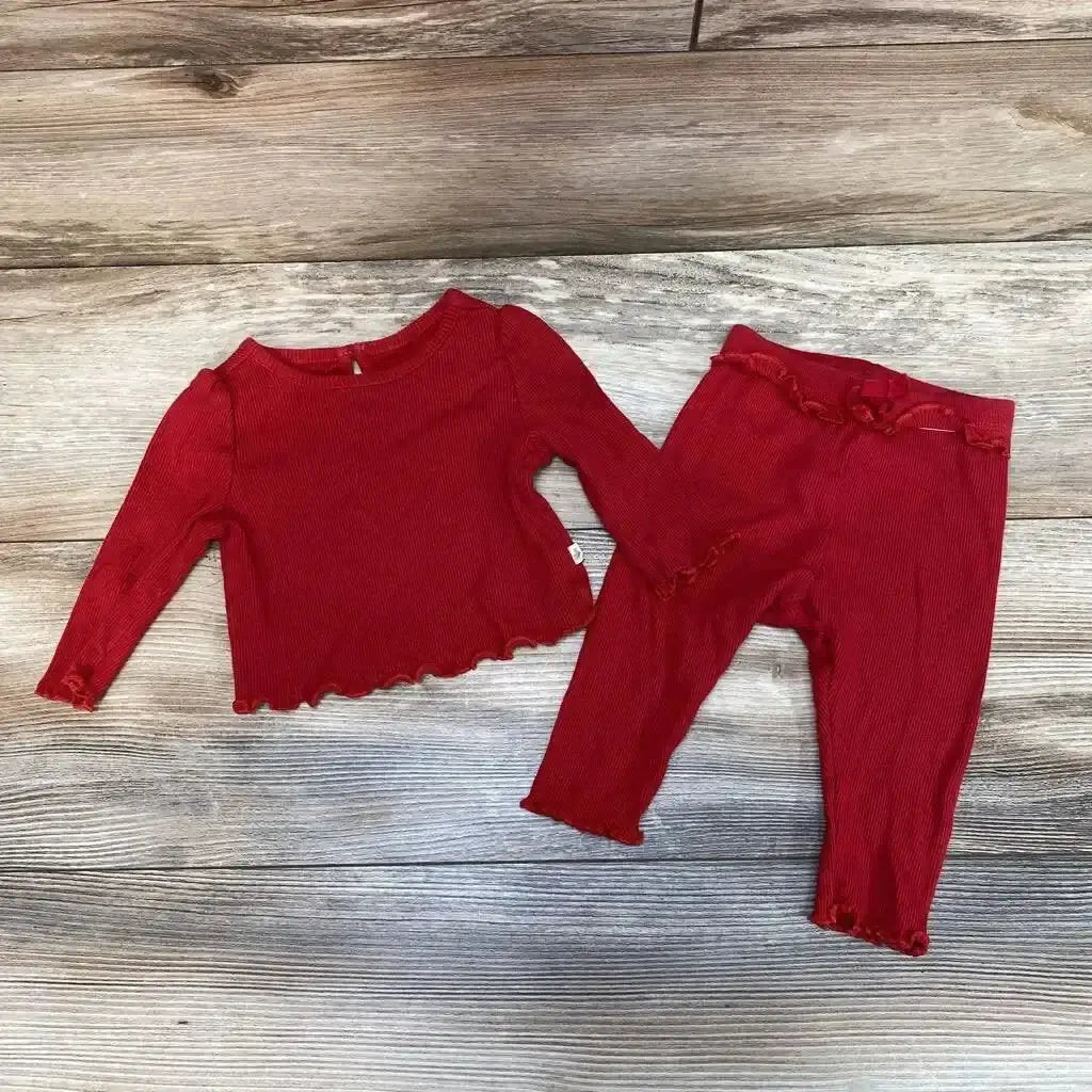 Flat lay of red BabyGap ribbed long-sleeve shirt and matching pants size 3-6M showing lettuce-edge hems on wood floor