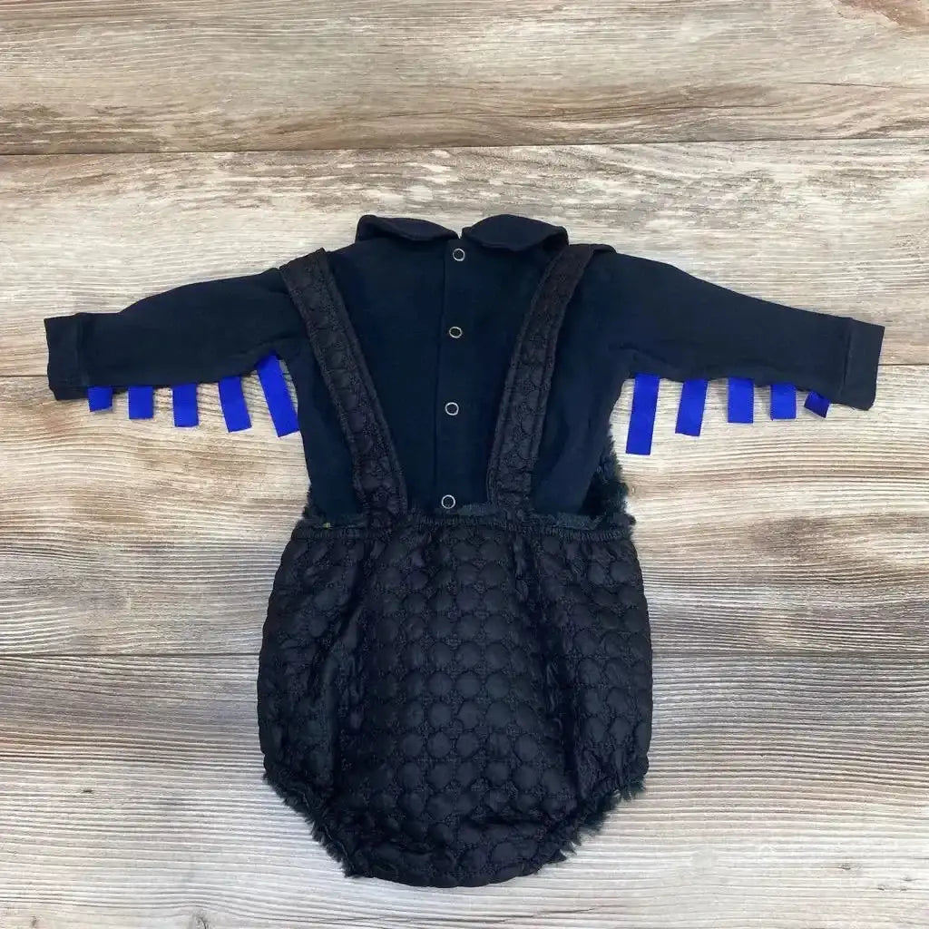Flat lay of Chua romper set (3-6m) showing black long-sleeve bodysuit with snaps and quilted faux fur suspender romper