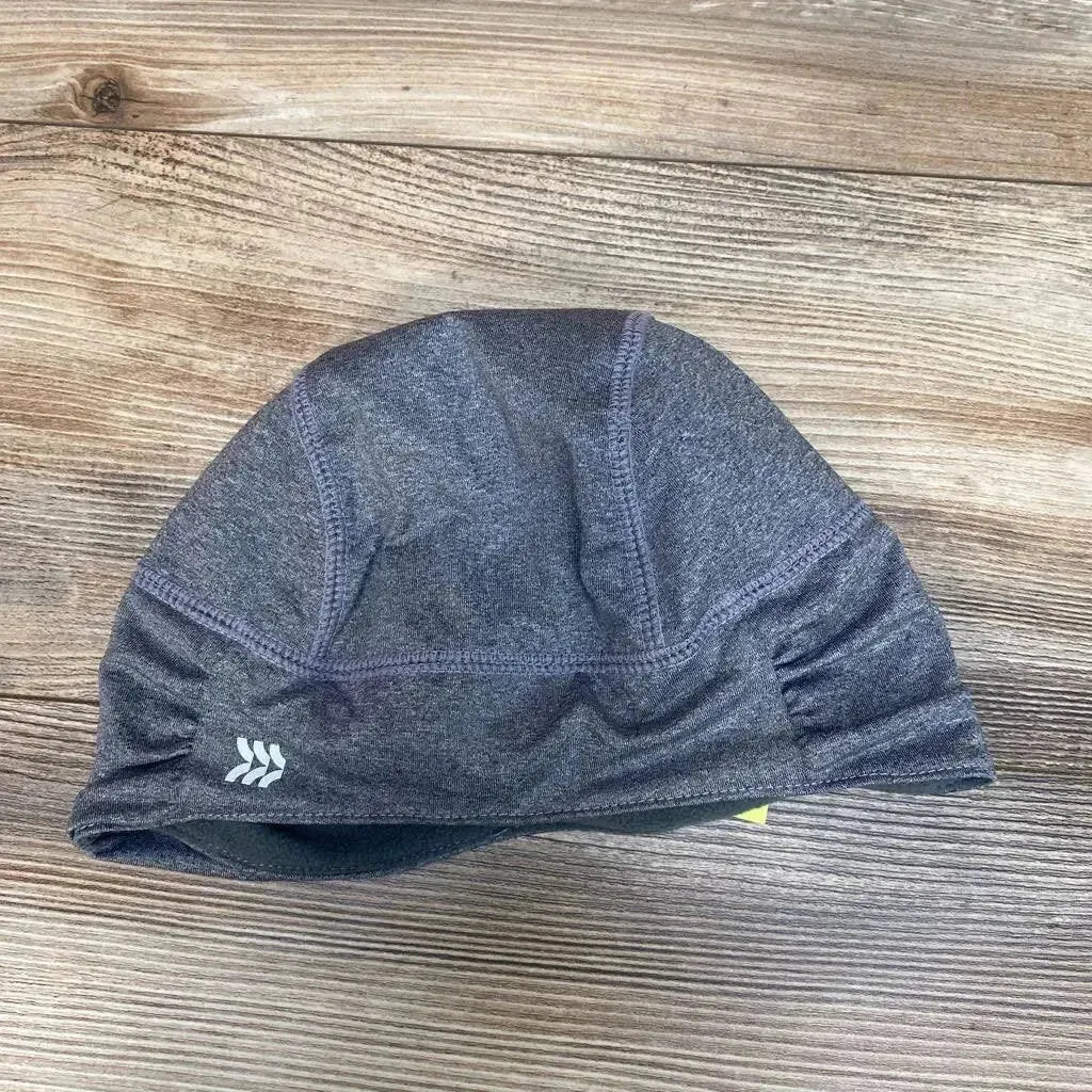 Flat lay of grey fleece-lined jersey beanie showing ruched side detail and inner lining on wood surface