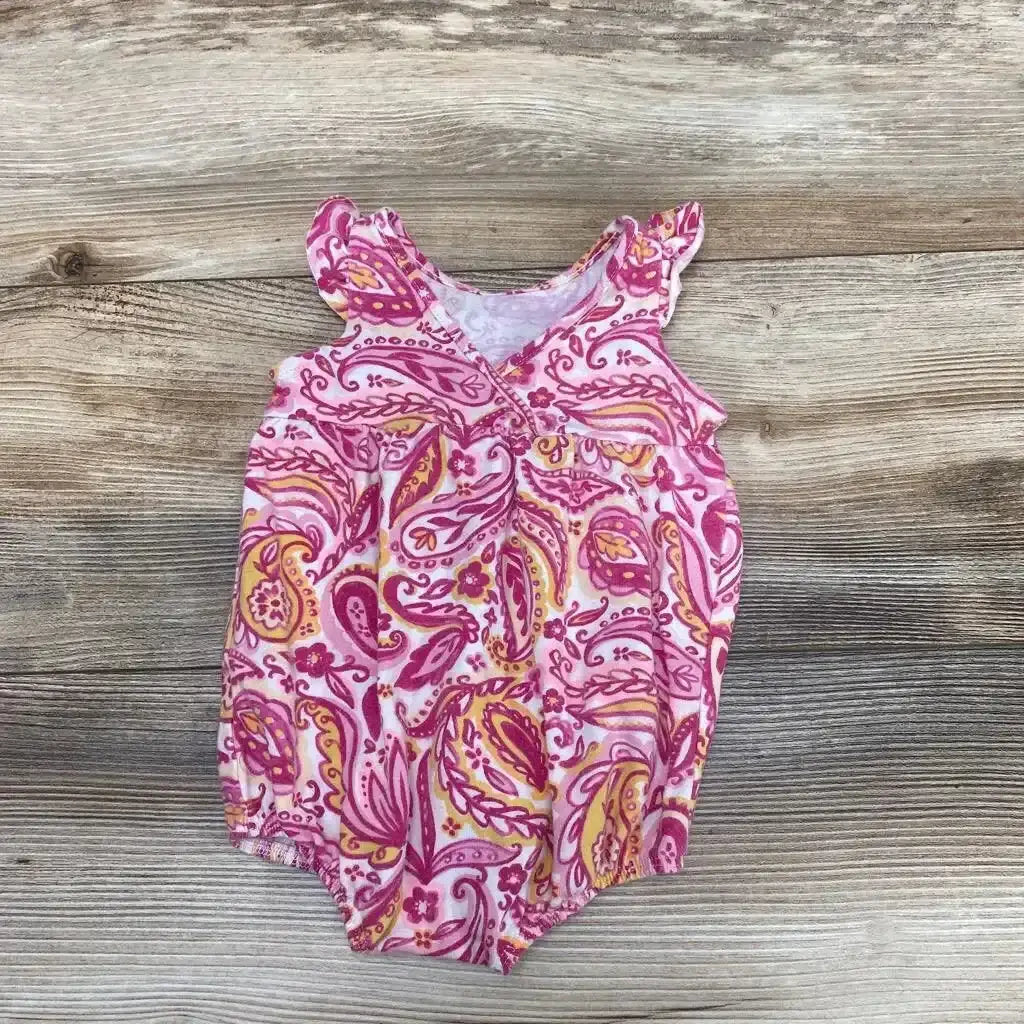 Front view of Cat & Jack tank paisley romper, size 0-3m, showcasing pink and purple paisley print on a wood background