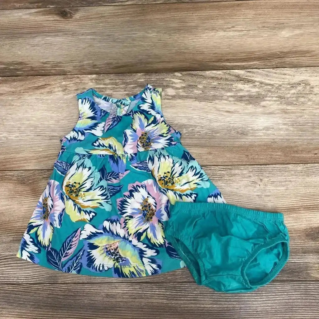 Top view of Carter’s 2pc Sleeveless Floral Dress & Bloomers sz 3m showcasing floral dress and matching bloomers on wood