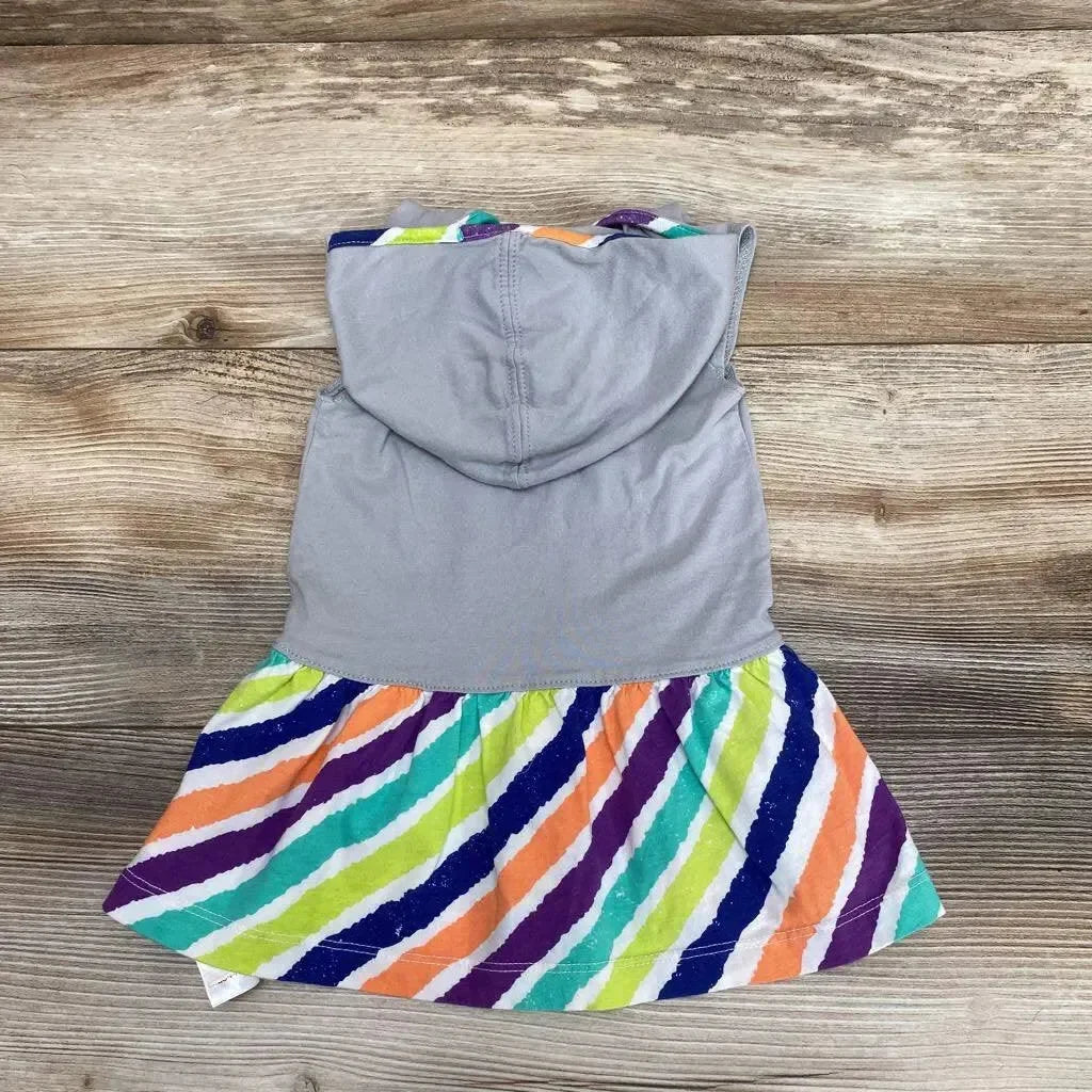 Flat lay of grey hooded dress, size 6-9m, showing sleeveless top and multicolored diagonal-striped skirt on wood background