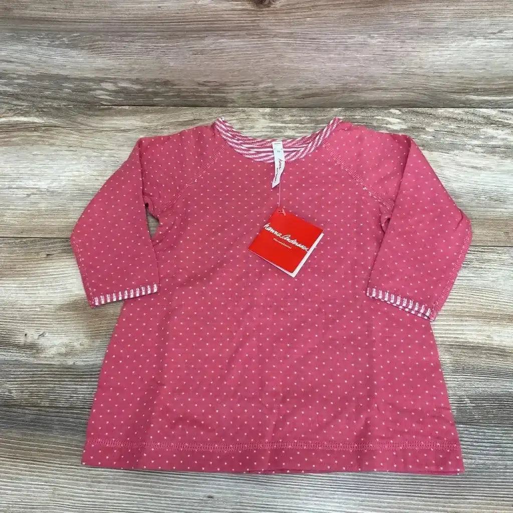 Front view of Hanna Andersson NEW Dress sz 6-12m showcasing a pink dotted pattern and long sleeves with a wood-grain background