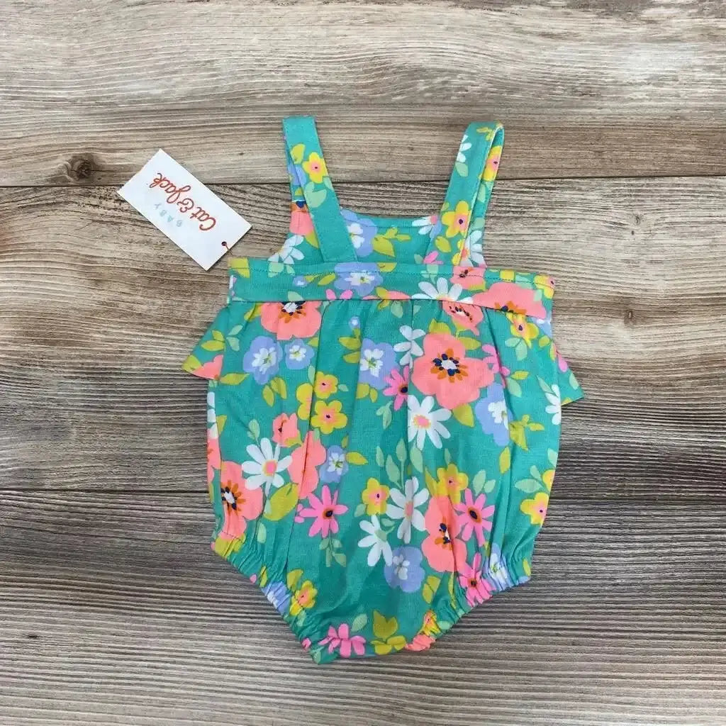 Top-down Cat & Jack newborn sunsuit in teal floral print with ruffle top, straps and elastic leg openings on wood backdrop