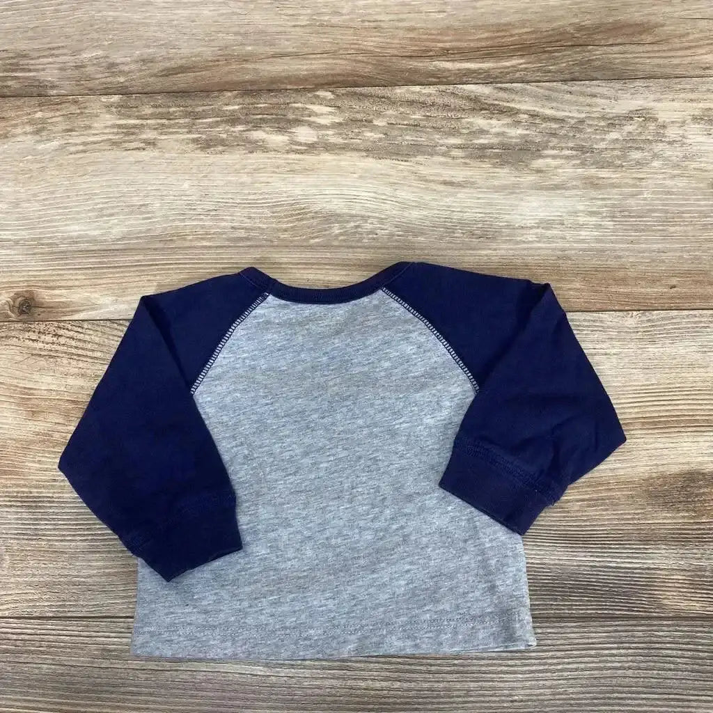 Back flat-lay of True Religion 6M long-sleeve raglan shirt showcasing navy sleeves and heather gray on wood surface