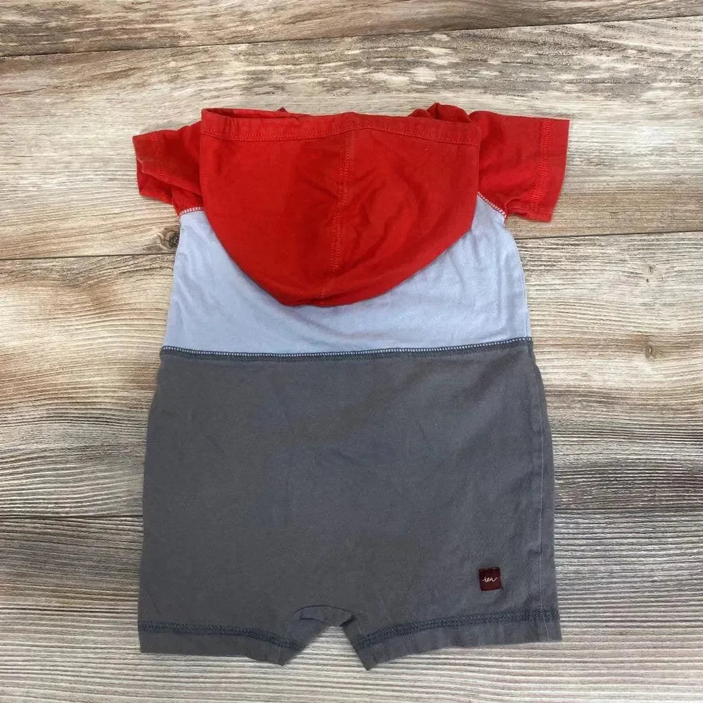 Flat-lay back of hooded colorblock romper with red hood, light blue middle and gray bottom, size 3–6 months on wood background