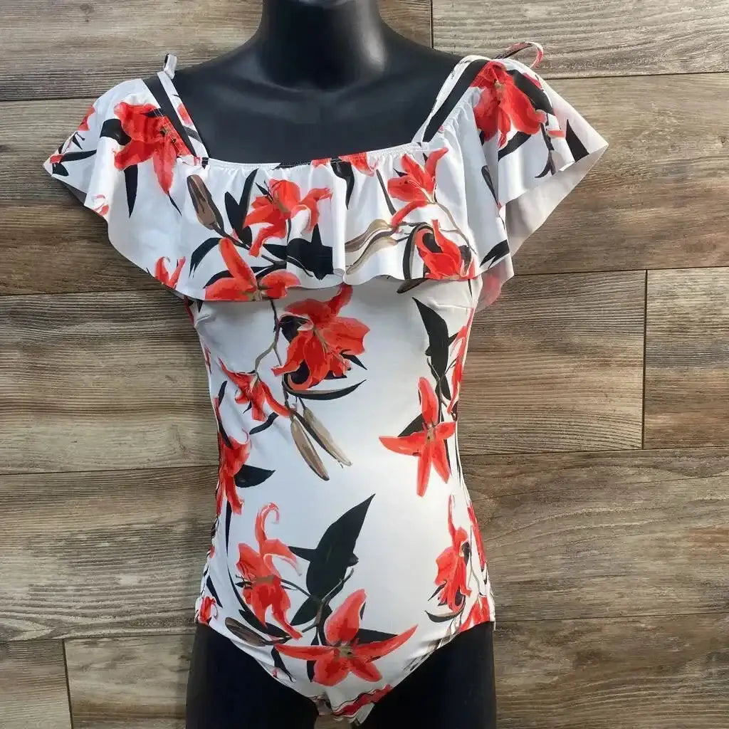 Front view of Albion one-piece floral swimsuit showcasing off-shoulder ruffle neckline and red floral print on white background with wood plank backdrop