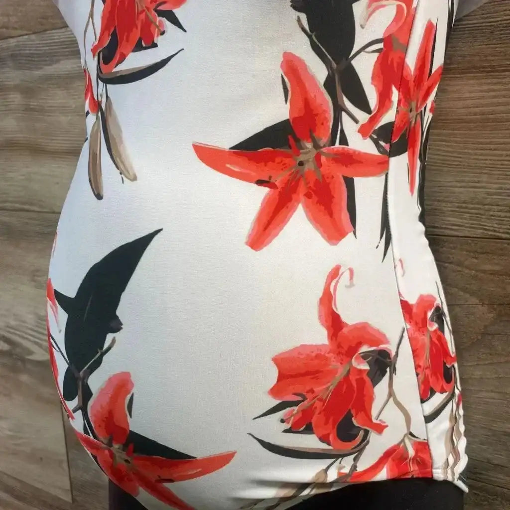 Front view of Albion one-piece white floral swimsuit showcasing scoop neckline and gathered waist on plain white background