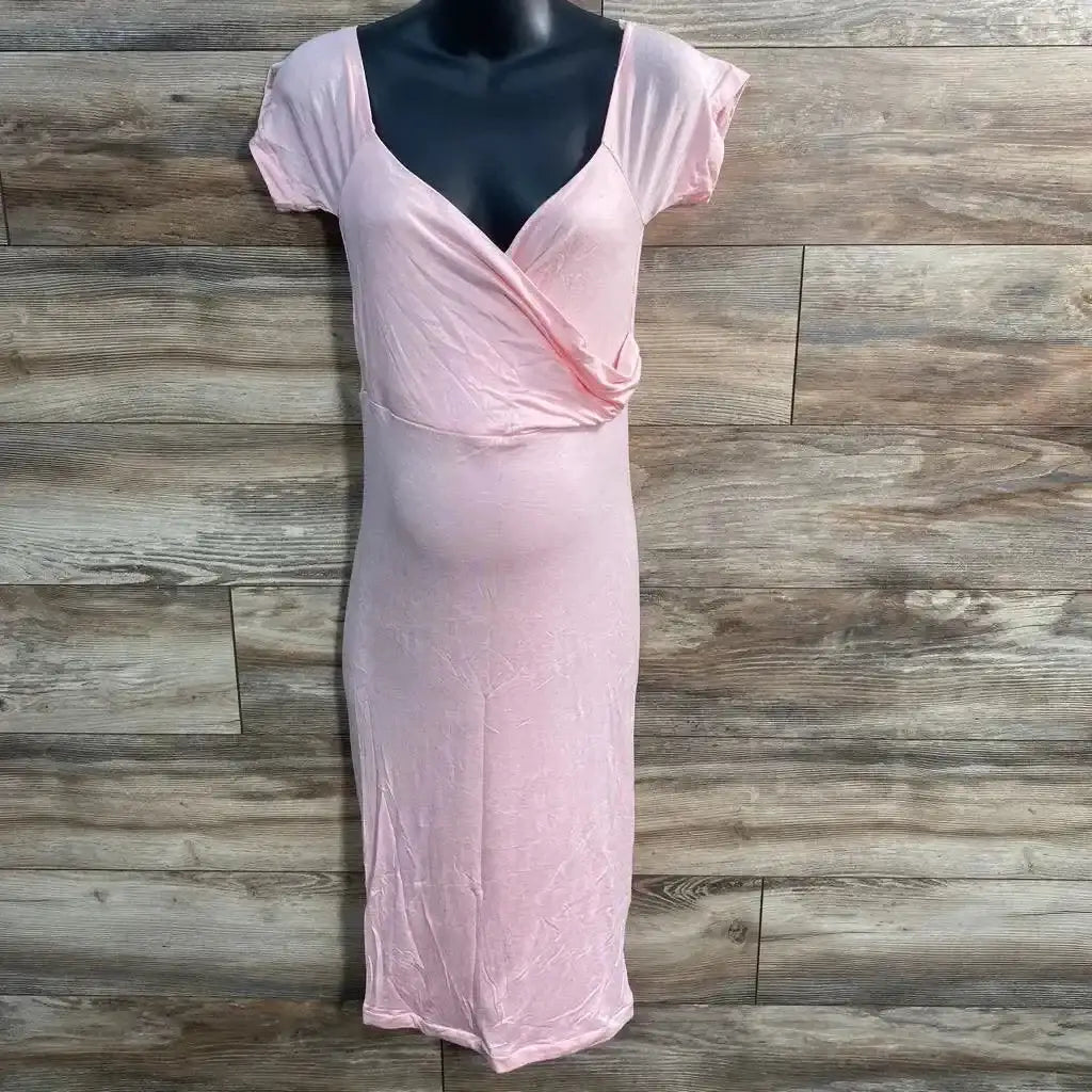 Front view of pink maternity off-the-shoulder midi dress showing wrap bodice and short sleeves against wood background