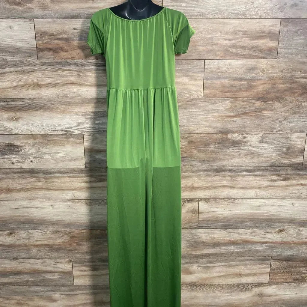Front view of green lace photoshoot dress, XL, with short sleeves and gathered waist on black torso mannequin, wood background