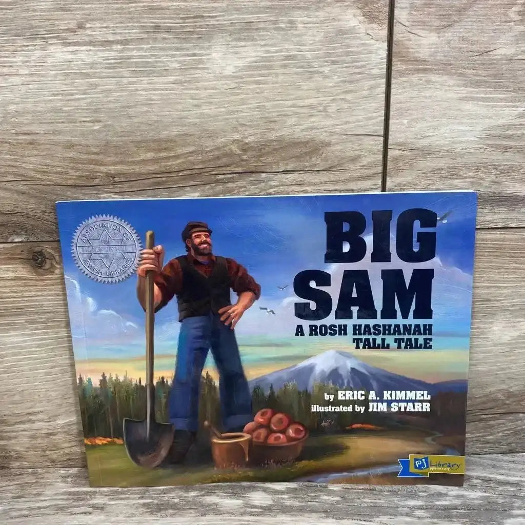 Front cover of paperback Big Sam showing a tall man with a shovel, bowl of apples, and mountain illustration on wood surface