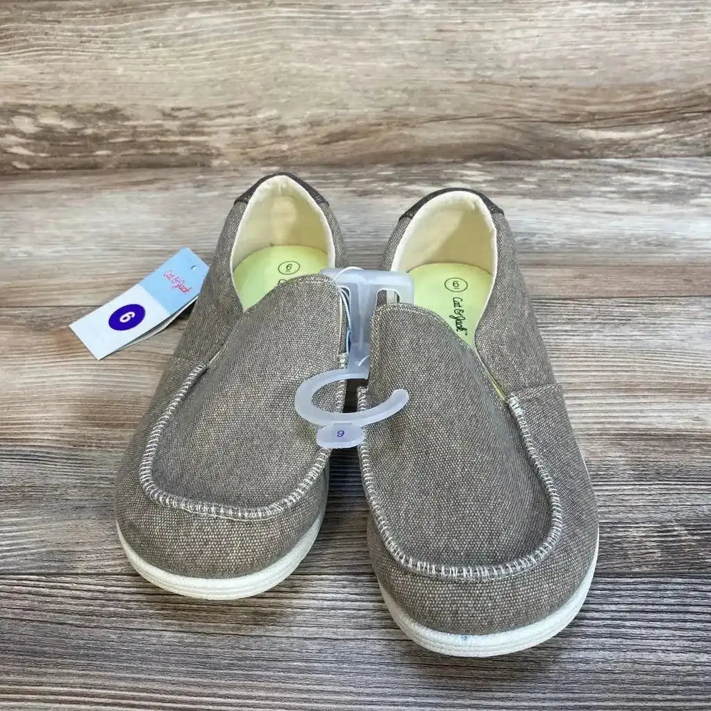 Top view of NEW Cat and Jack Bergen slip-on sneakers size 6Y showcasing brown canvas upper and hangtag on wood plank floor