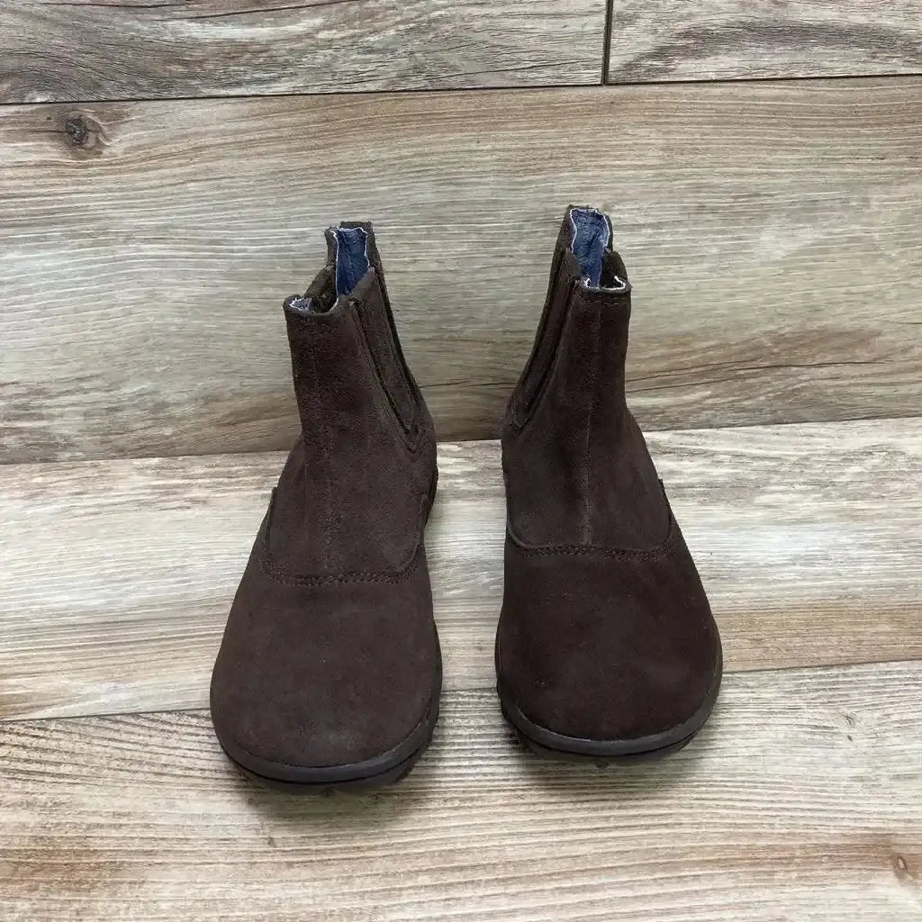 Front view of Bogs Wall Ball Chelsea boots in brown, size 1Y, showcasing suede upper and elastic side panels on light wood background