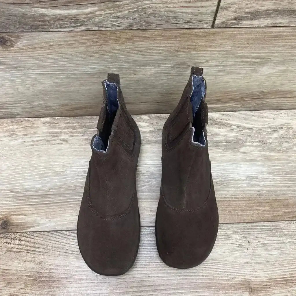 Top view of brown Bogs Chelsea toddler boots size 1Y showing elastic side panels and pull tabs on wood floor