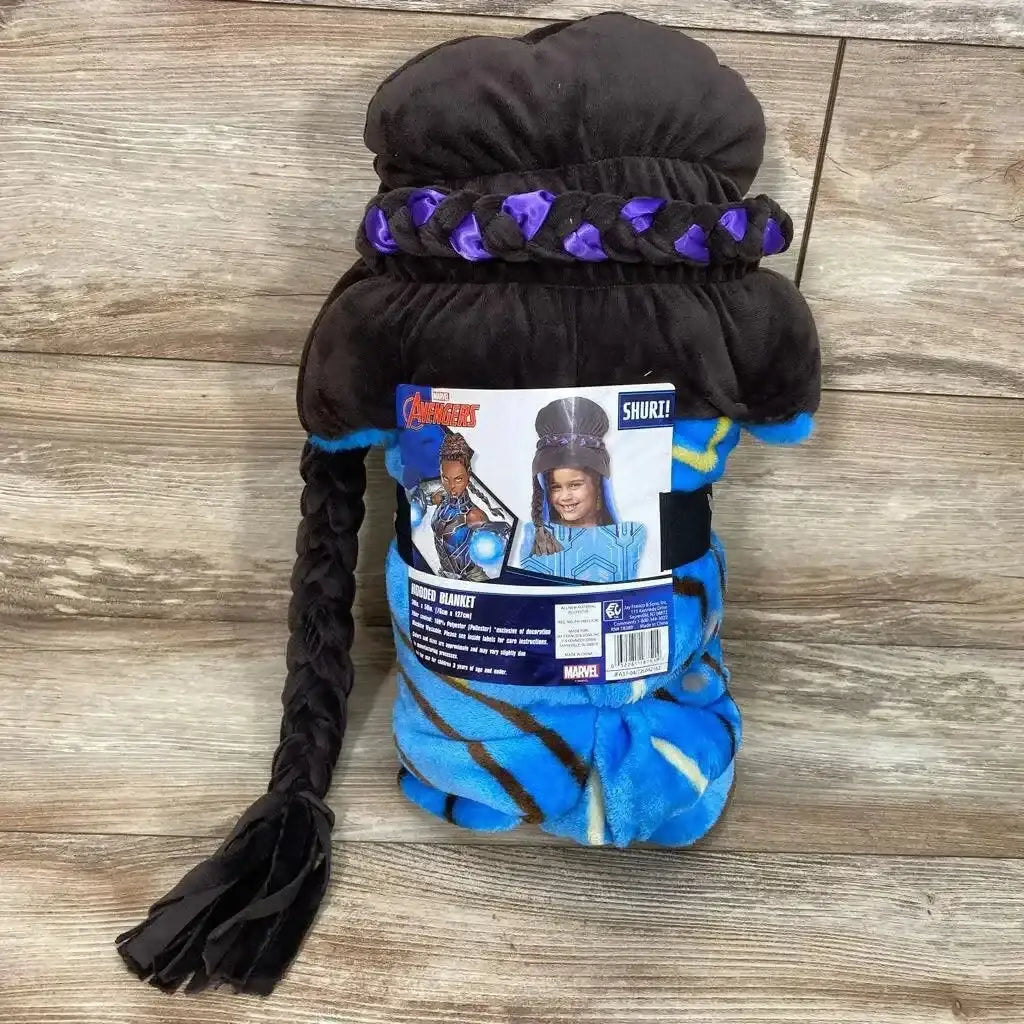 Rolled view of Shuri hooded blanket showing braided black hood with long braid and blue patterned blanket on wood floor