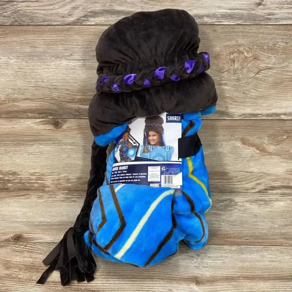 Front view of NEW Marvel Black Panther Shuri hooded blanket with blue patterned fabric and character hood on wood background
