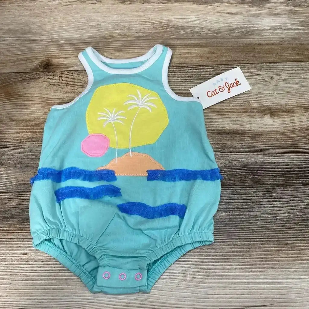 Front view of NEW Cat & Jack Beach Applique Romper sz 0-3m showcasing teal tank bodysuit with sunset palm tree applique and hangtag on wood plank floor