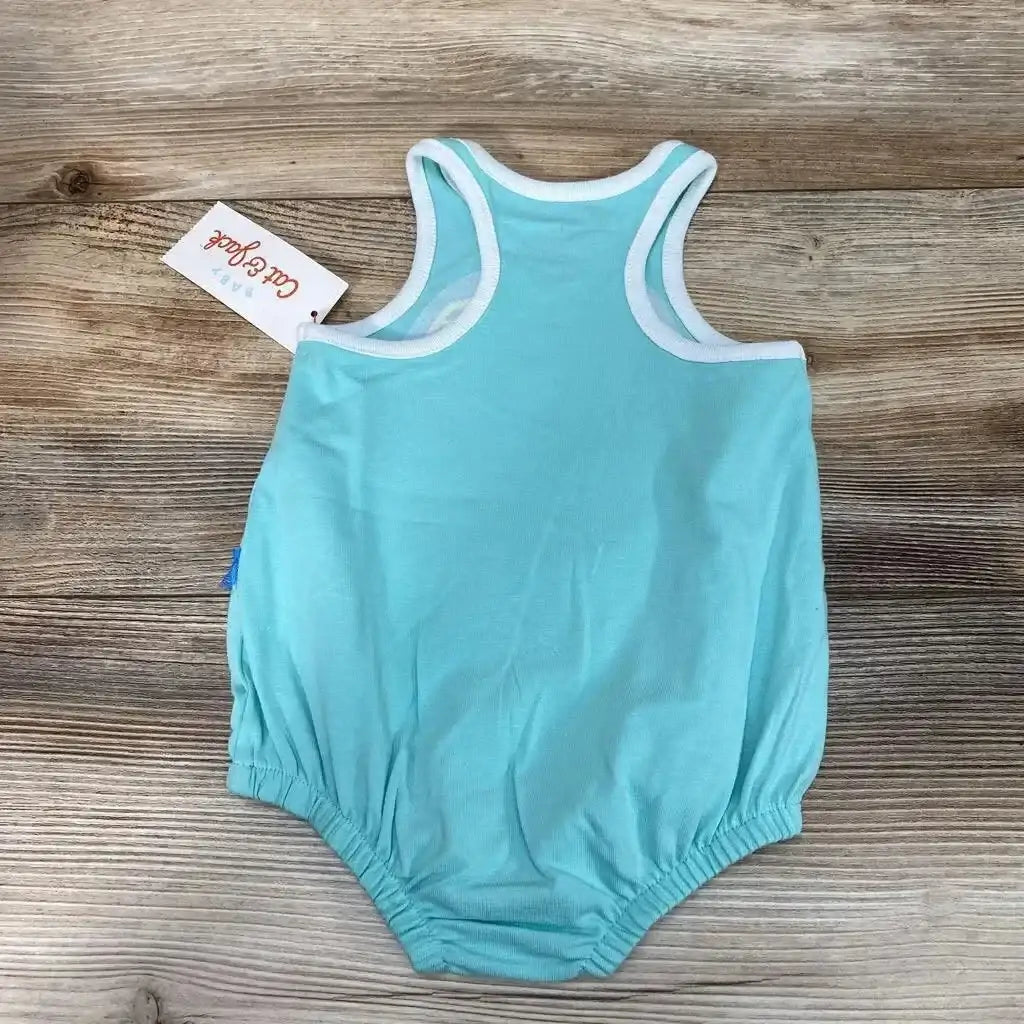 Back view of blue Cat & Jack baby romper 0-3M showing white arm trim and elastic leg openings on wood background