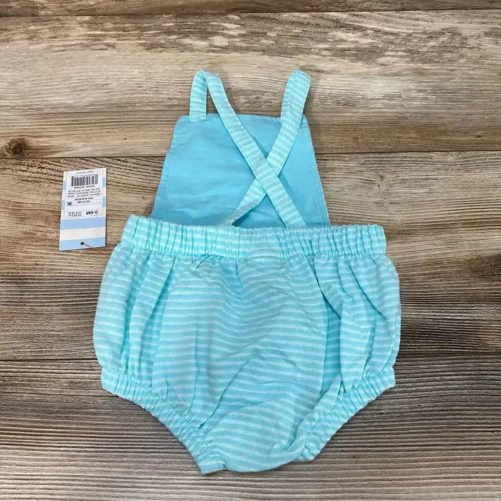 Back view of NEW Cat and Jack Striped Romper size 3-6M in mint and white stripes with crossback straps and retail hangtag on wood plank floor