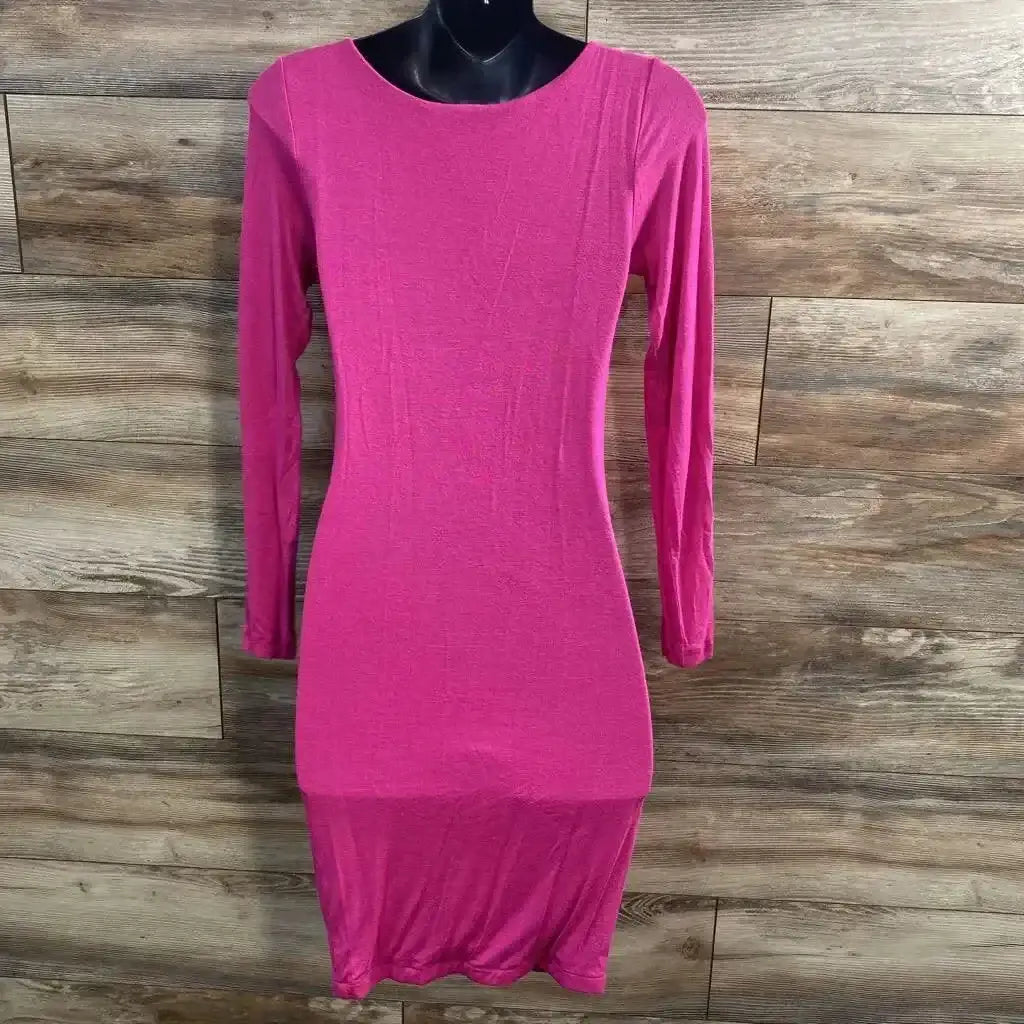 Front view of pink Sexy Mama maternity dress XS showing long sleeves and fitted shape on mannequin against wood background