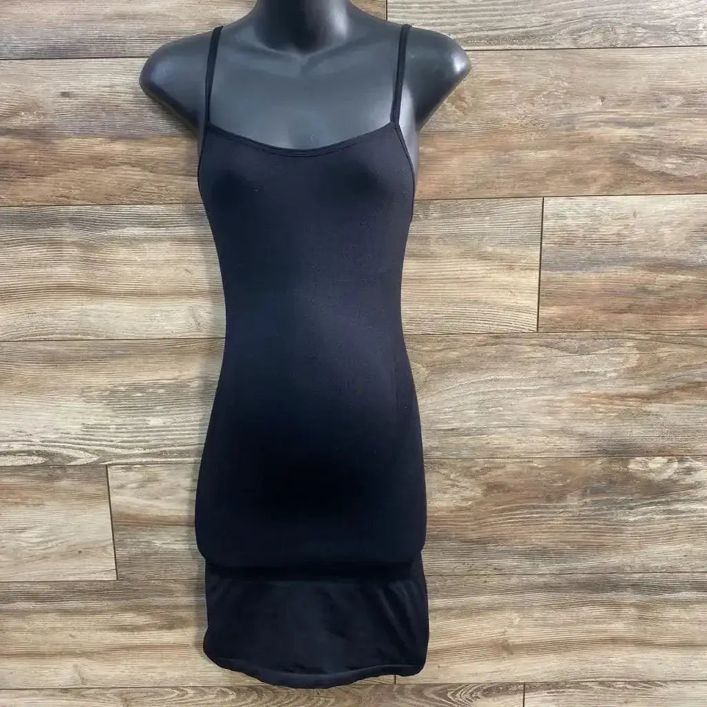 Front view of Blanqi maternity camisole slip black on torso mannequin showing slim fit and straps against wood background