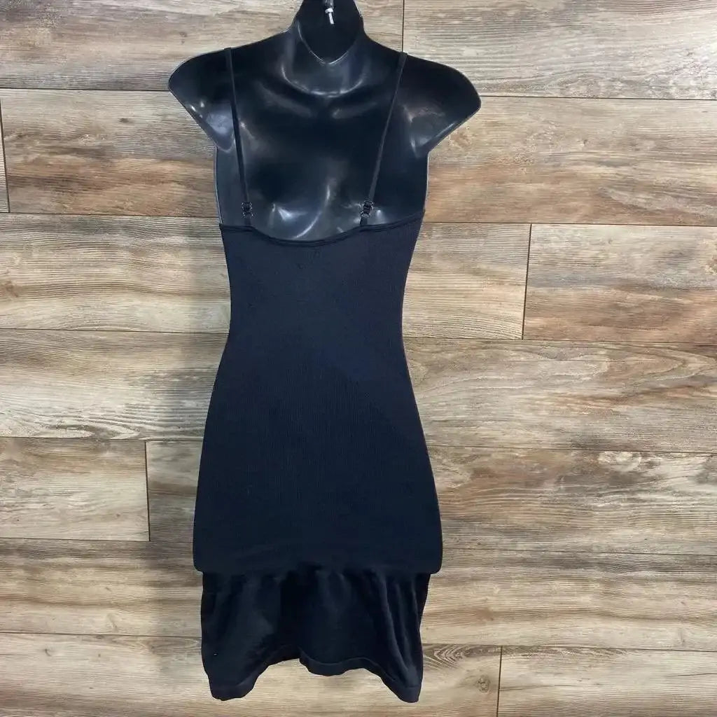 Front view of black Blanqi maternity camisole slip on mannequin, fitted ribbed body, adjustable thin straps, wood floor background