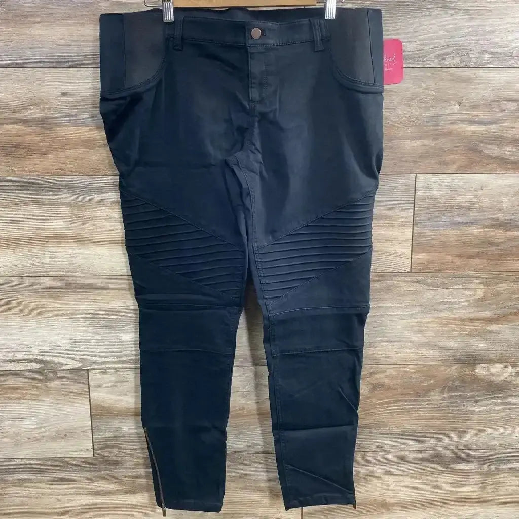 Front view of black Isabel maternity jeggings size 14 showing ribbed knees, ankle zips and over-belly panel on wood floor