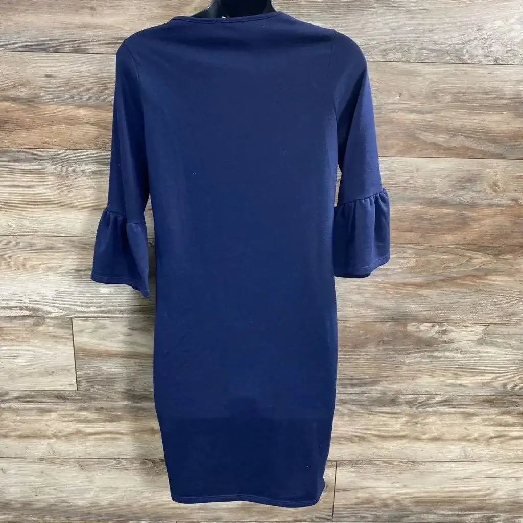 Front view of Pink Blush maternity dress in navy blue with three-quarter bell sleeves on dress form on wood plank floor