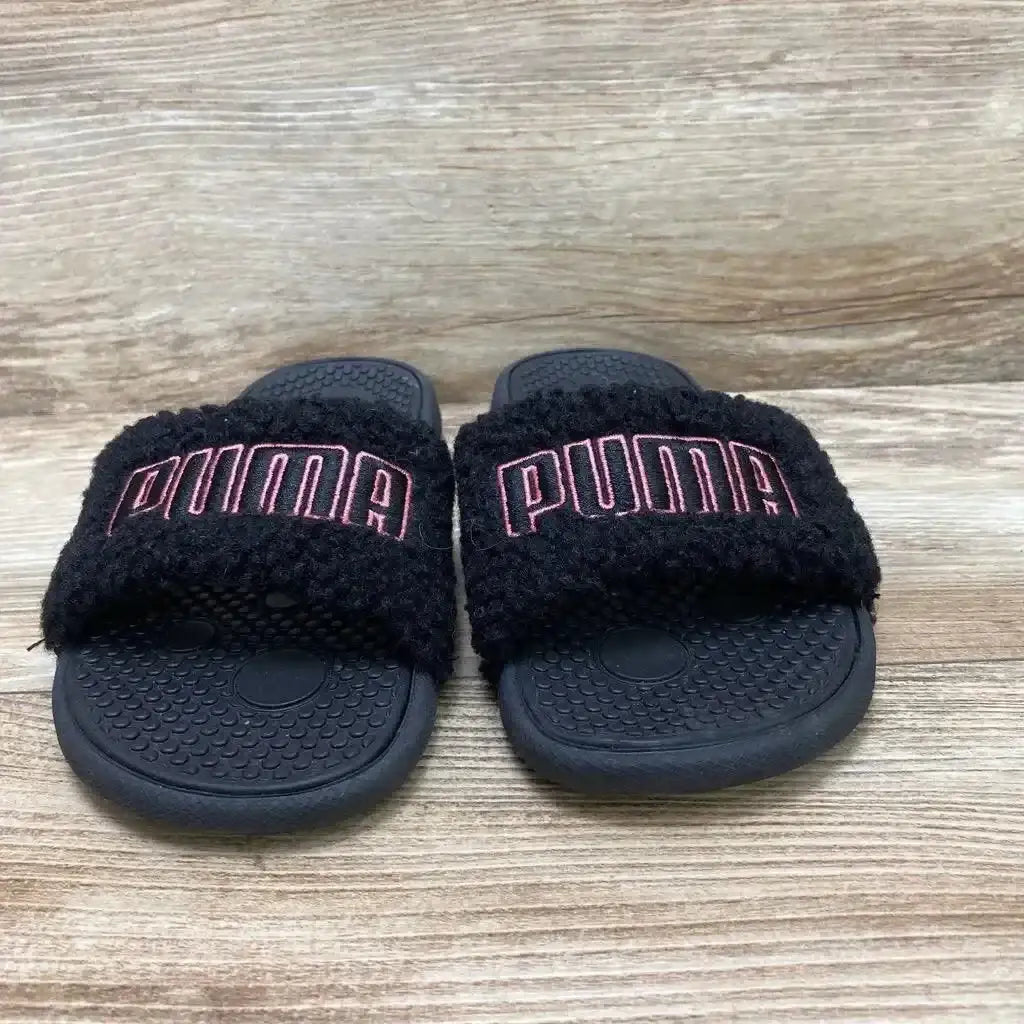 Side view of Puma Cool Cat Sherpa toddler slide in black, size 3Y, showcasing fluffy sherpa strap and textured rubber sole on white background