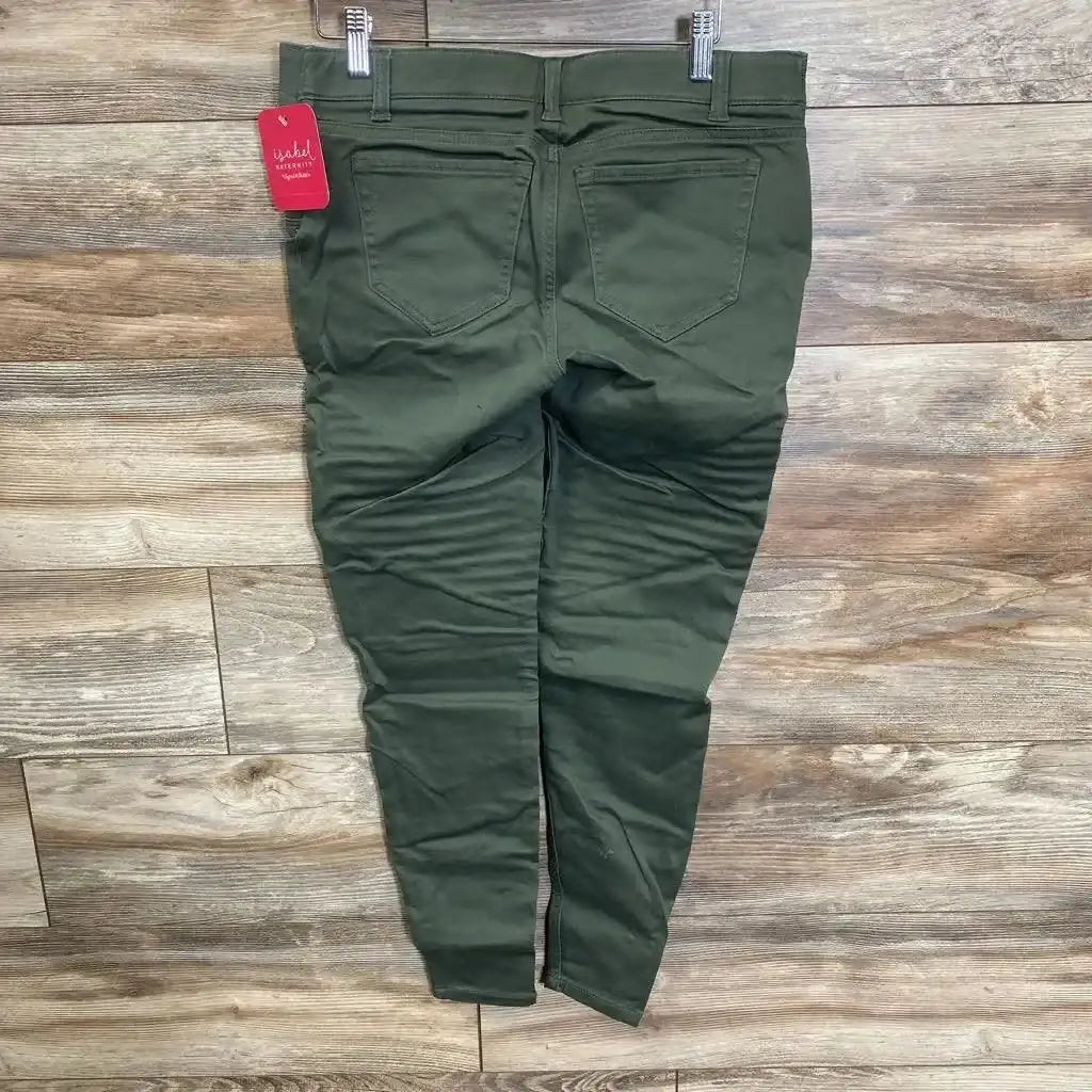 Back view of olive maternity utility jeggings, size 0, showing back pockets and tapered legs on wood floor background