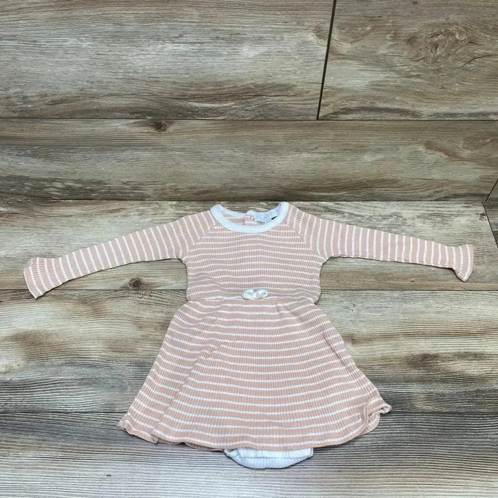 Flat-lay of pink striped long-sleeve baby bodysuit dress (18M) with attached skirt and snap bottom on wood floor