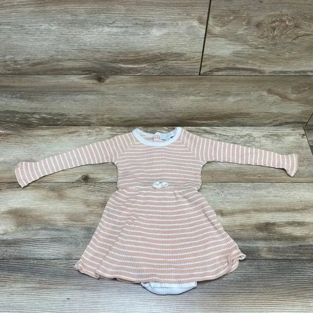 Flat-lay of pink striped long-sleeve baby bodysuit dress (18M) with attached skirt and snap bottom on wood floor
