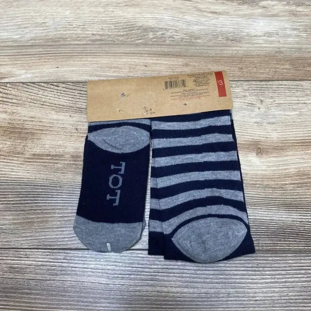 Flat lay of Best Ever socks for dad and child in navy and gray stripes with TOT lettering and brown packaging band