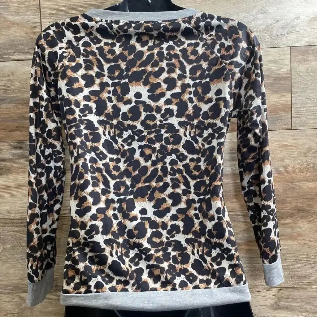 Front view of leopard-print maternity nursing shirt, medium, showing short sleeves and scoop neckline on white background