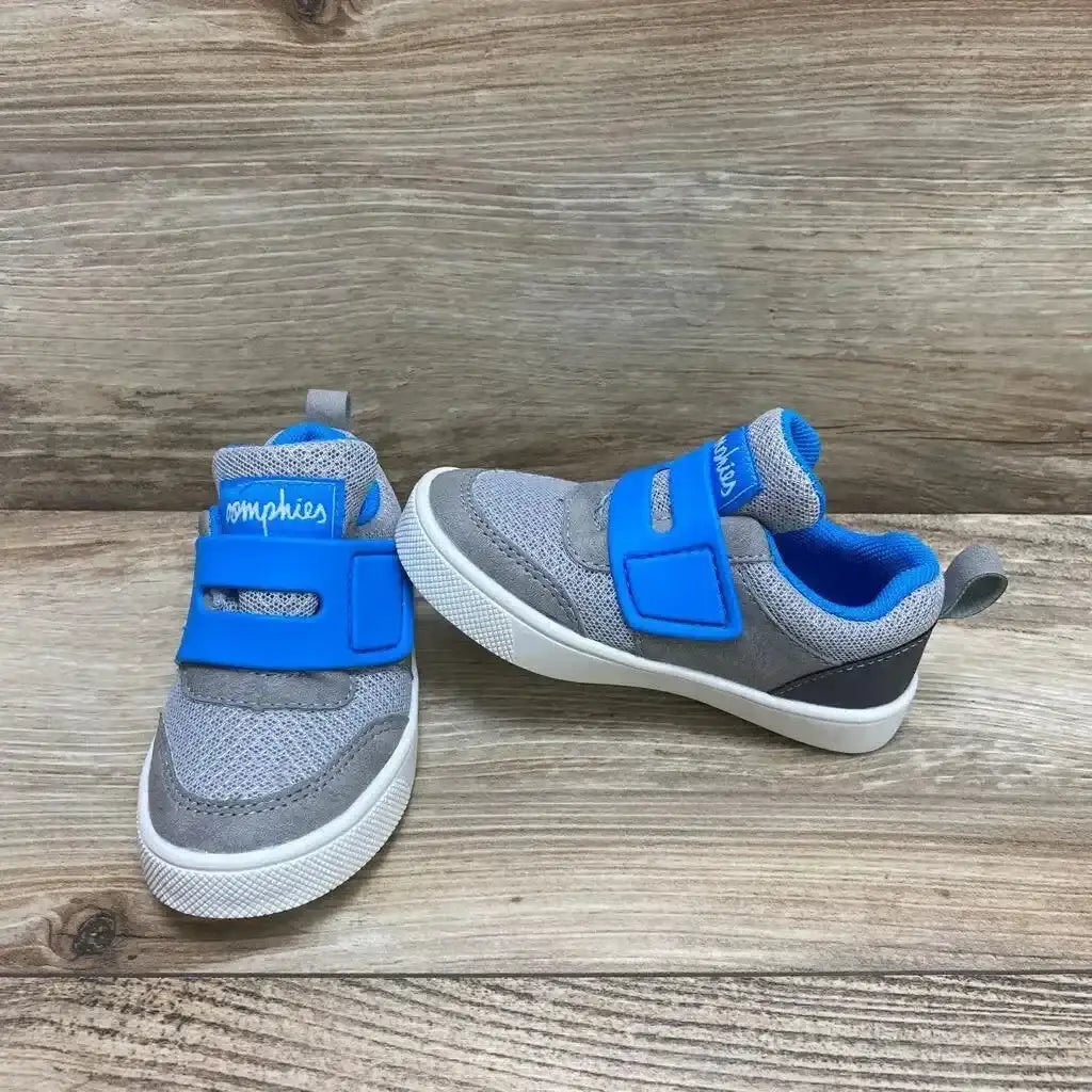 Side view of NEW Oomphies Devon Sneakers sz 7c showcasing grey mesh upper with blue hook-and-loop strap and white sole on wood plank background
