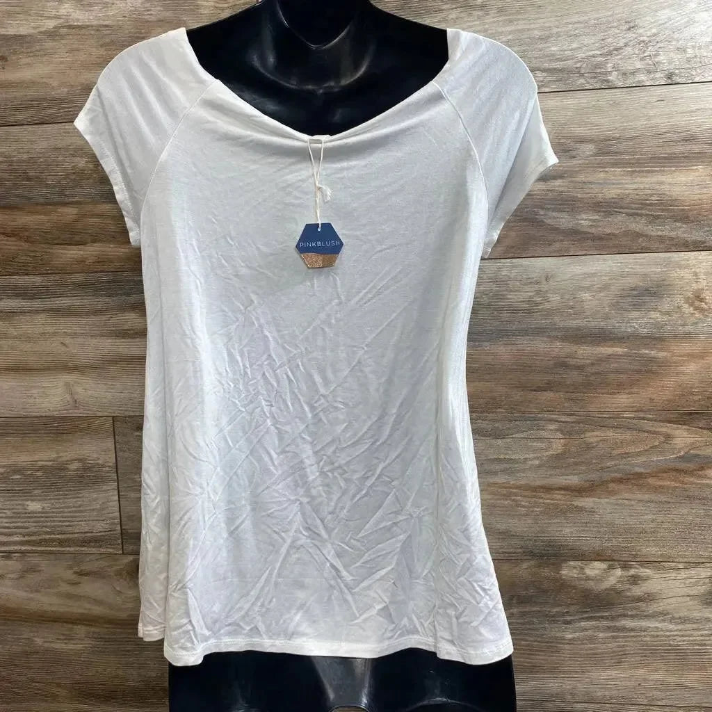 Front view of white maternity short-sleeve scoop-neck shirt showing soft drape and PinkBlush tag on wood plank background