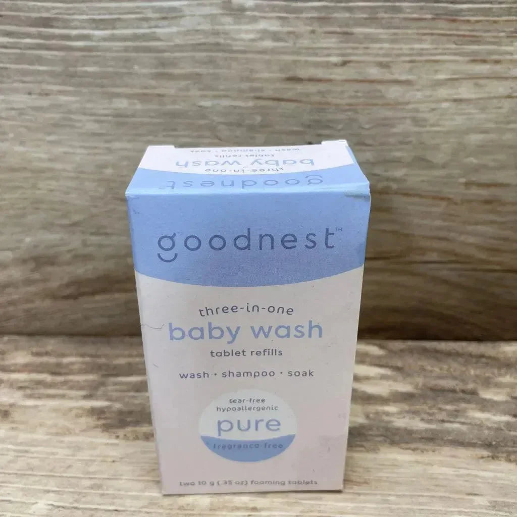 Front view of NEW Goodnest 3-in-1 Wash Shampoo and Soak Tablet Refills showcasing blue and white baby wash box labeled tear-free hypoallergenic on wood plank floor