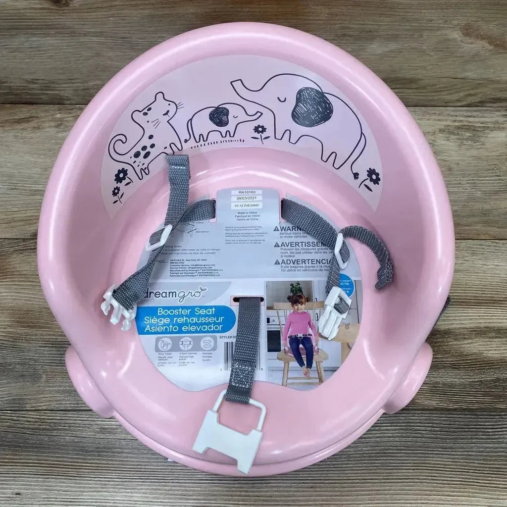 Top view of DreamGro Elephant booster seat in pink showing grey safety straps and elephant and cat interior print on wooden floor