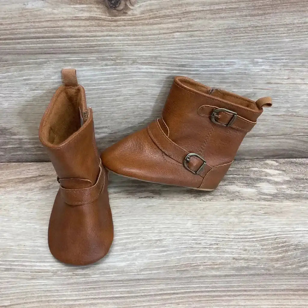 Three-quarter view of brown Old Navy faux-leather tall booties (size 3/4C) showing side buckle on white background