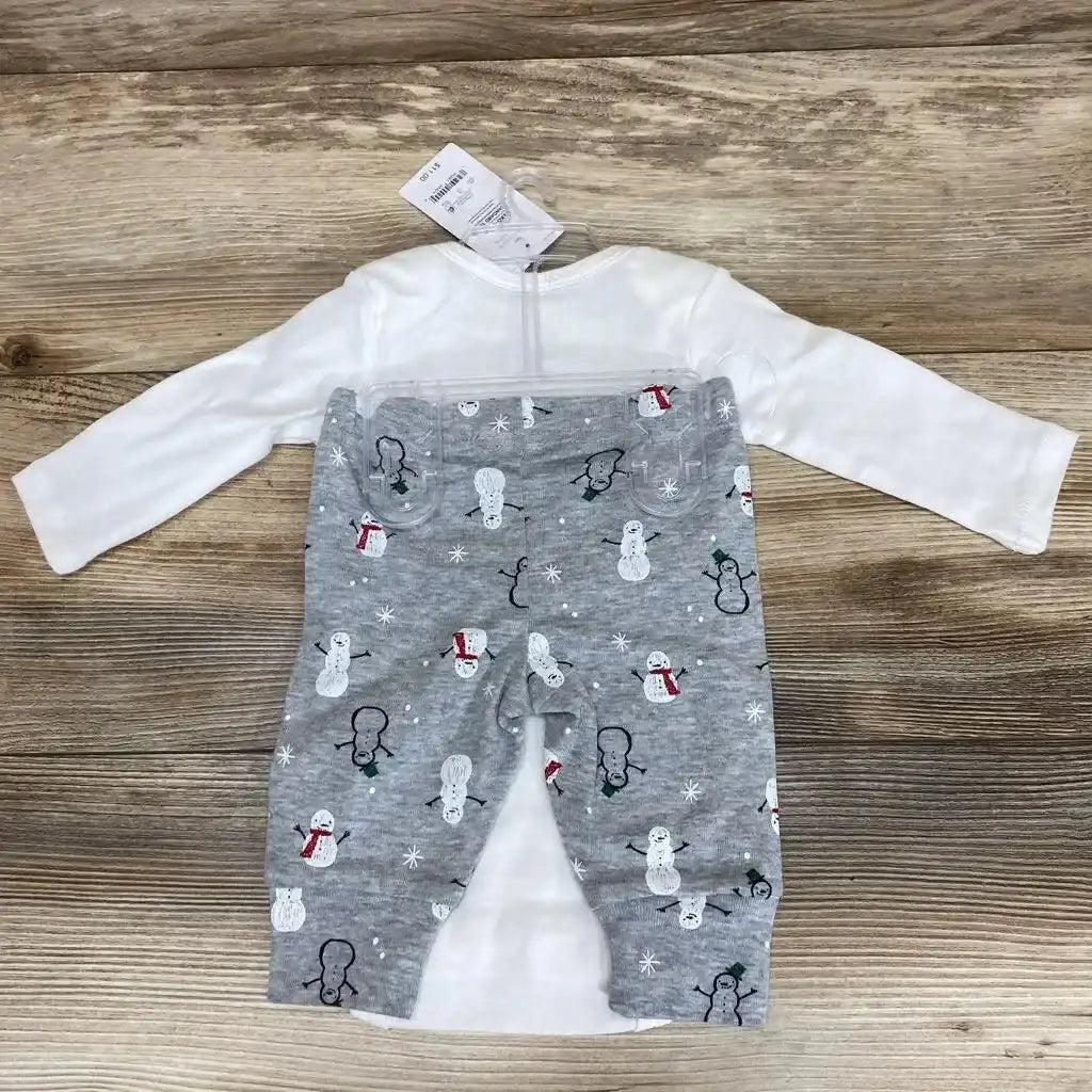 Flat lay of NEW Just One You 2pc Snow Much Love bodysuit set sz 3m showcasing white bodysuit and grey snowman print pants with hangtag on wood