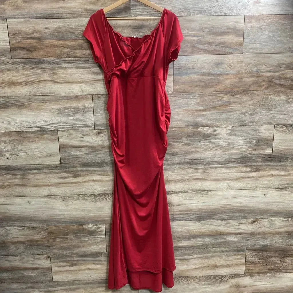 Front view of red off-shoulder wrap dress (size 1X) showcasing ruched sides and floor-length drape on a wooden plank background