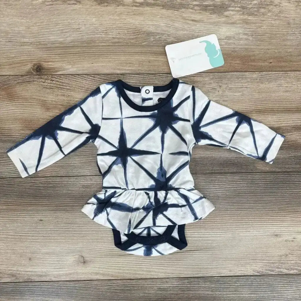 Flat lay of Monica and Andy Shibori Dress Bodysuit sz 0-3m in navy and white tie-dye with peplum skirt and hangtag on wood