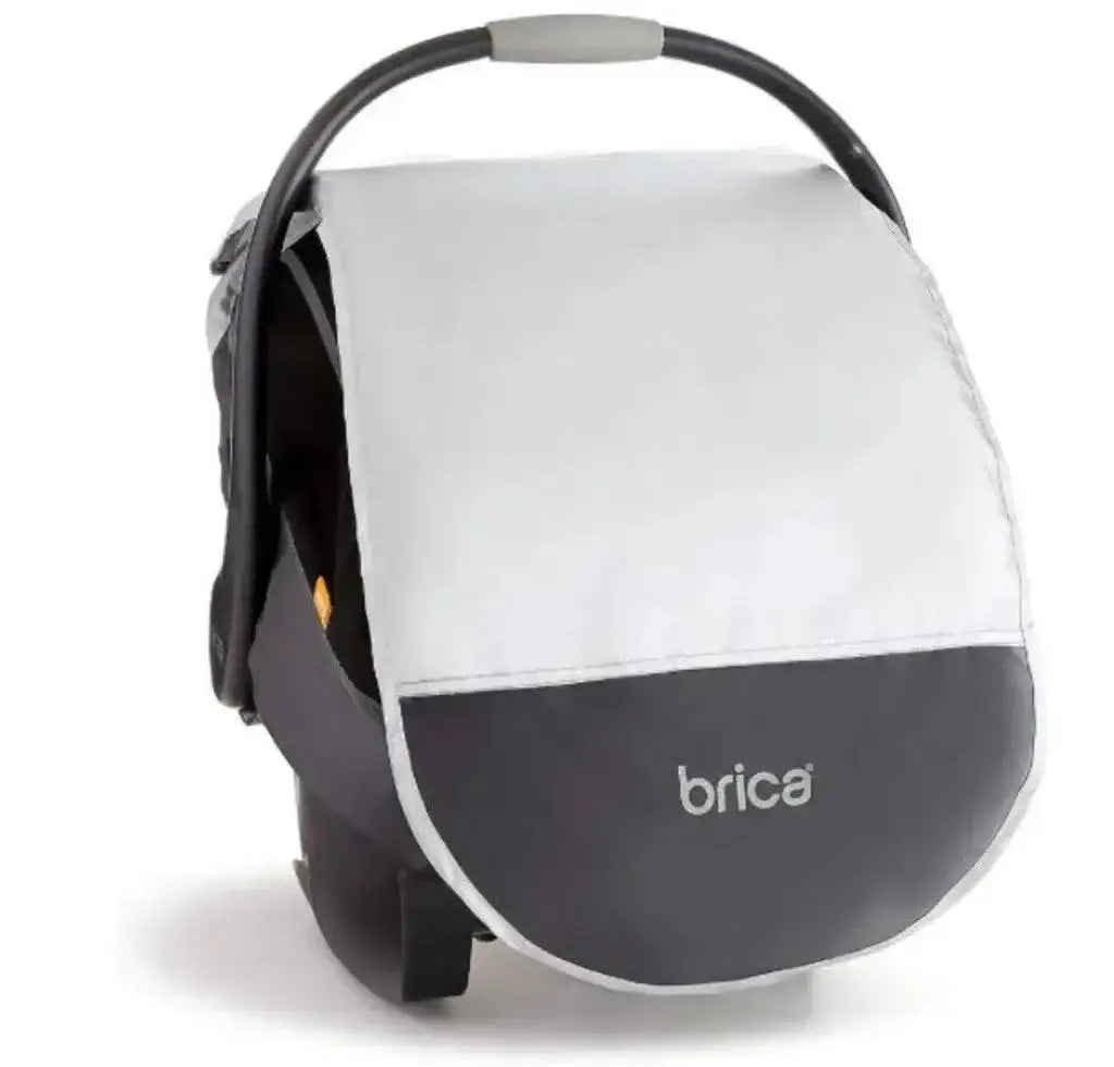 Front view of Brica infant car seat comfort canopy showcasing grey stretch fabric and elastic edge on plain white background