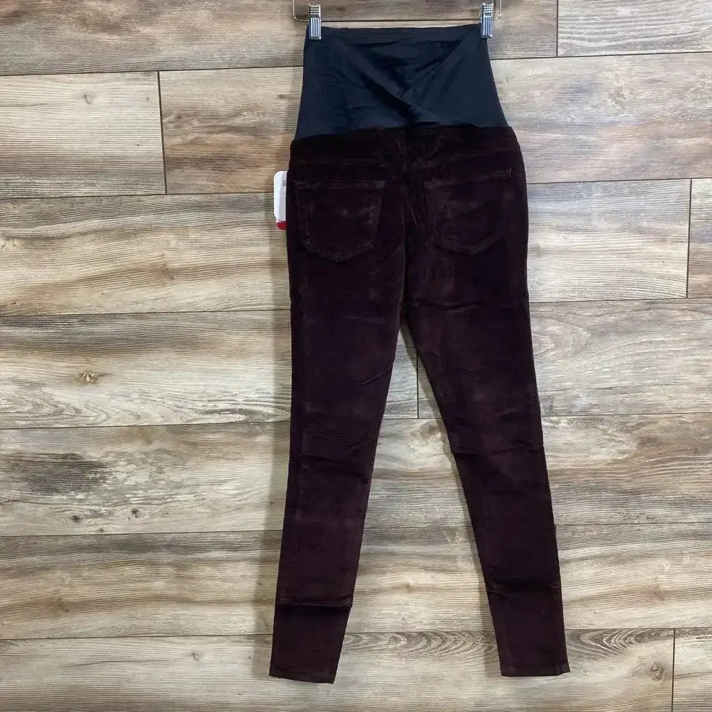 Front view of Isabel maternity crossover-panel skinny jeans in burgundy showing belly panel on white background