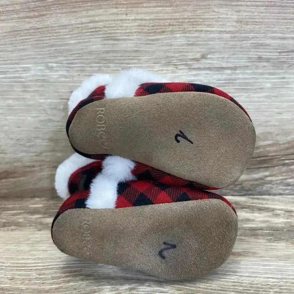 Top view of Robeez baby soft-sole boots in red plaid showing white faux-fur cuffs and suede soles marked 2 on wood background