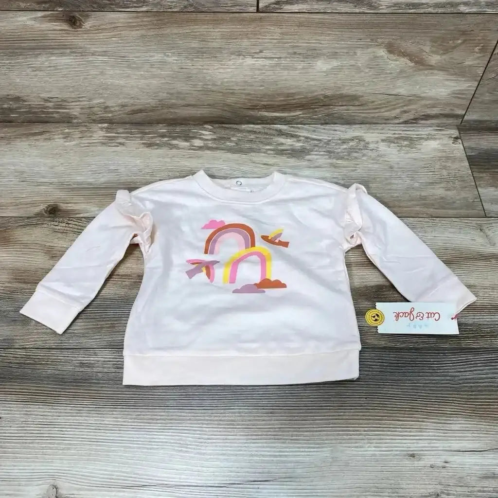 Front view of NEW Cat & Jack rainbow sweatshirt in size 6-9m showcasing long sleeves on a wood-grain background