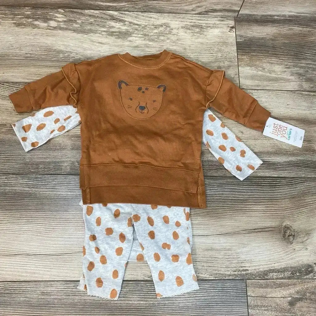Flat lay of Just One You three piece baby sweatshirt set with brown bear sweatshirt, gray spotted bodysuit and pants on wood floor