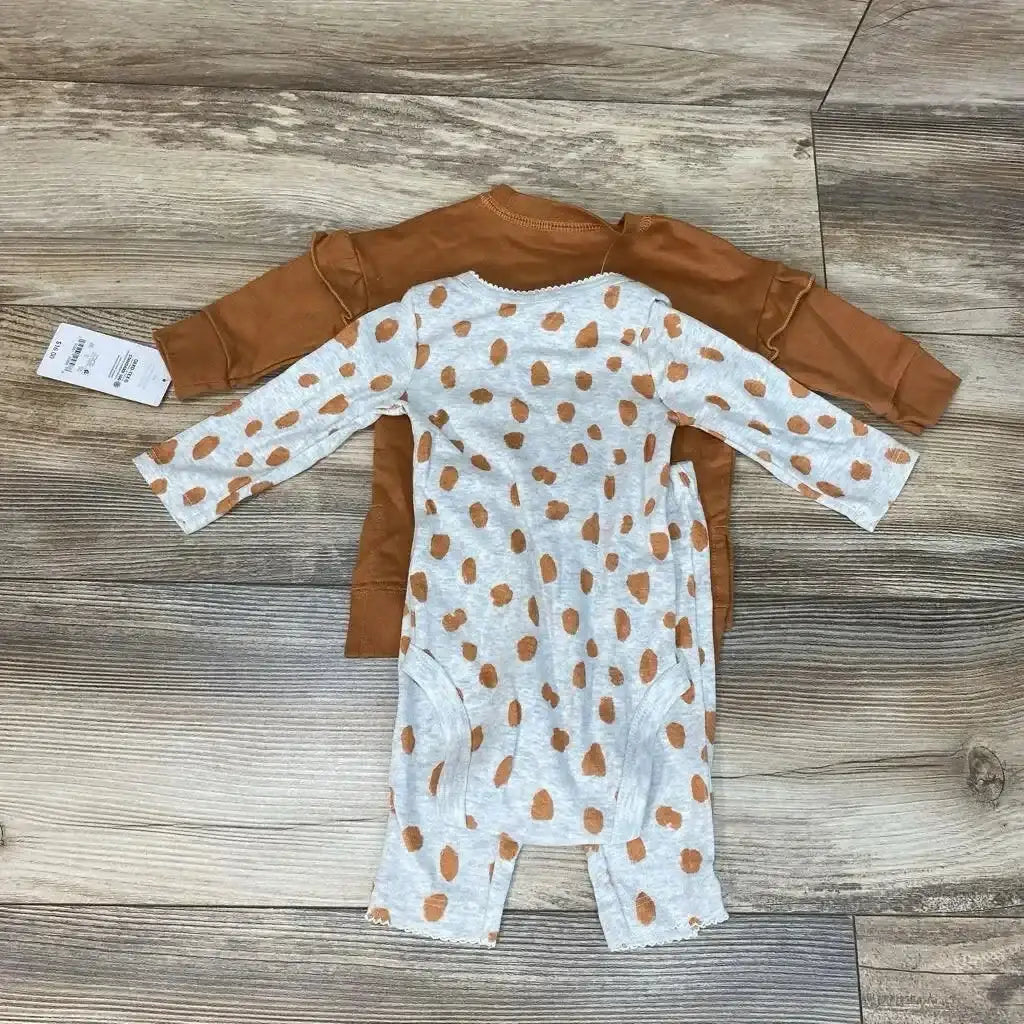 Flat lay of NWT Just One You 3pc sweatshirt set sz 3m showcasing camel solid and heather gray spotted print pieces with hangtag on wood plank floor