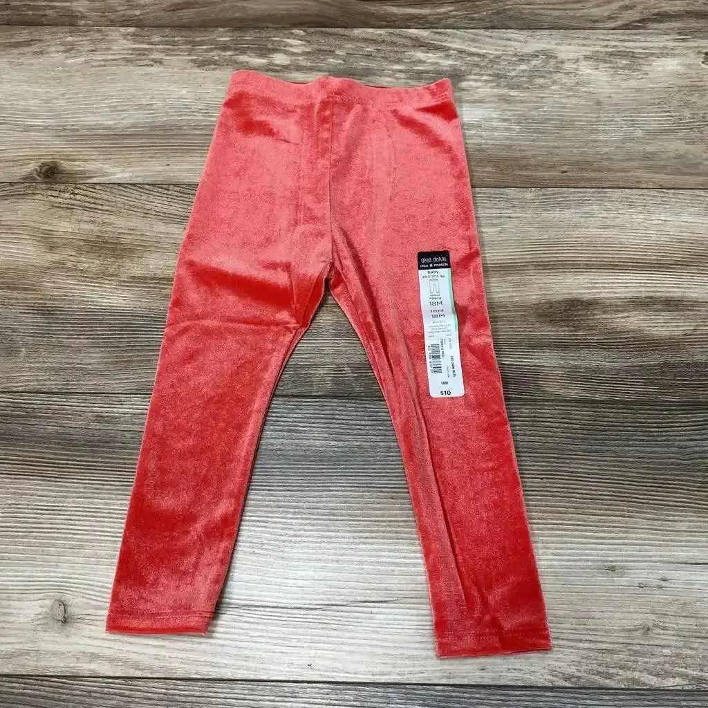 Front view of NEW Okie Dokie velour leggings size 18M showcasing red velour fabric on a wood-grain background