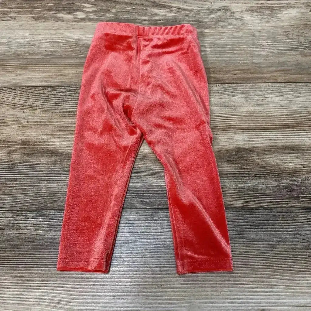 Front view of NEW Okie Dokie Velour Leggings sz 6M showcasing red velour fabric and elastic waistband with a wood-grain background